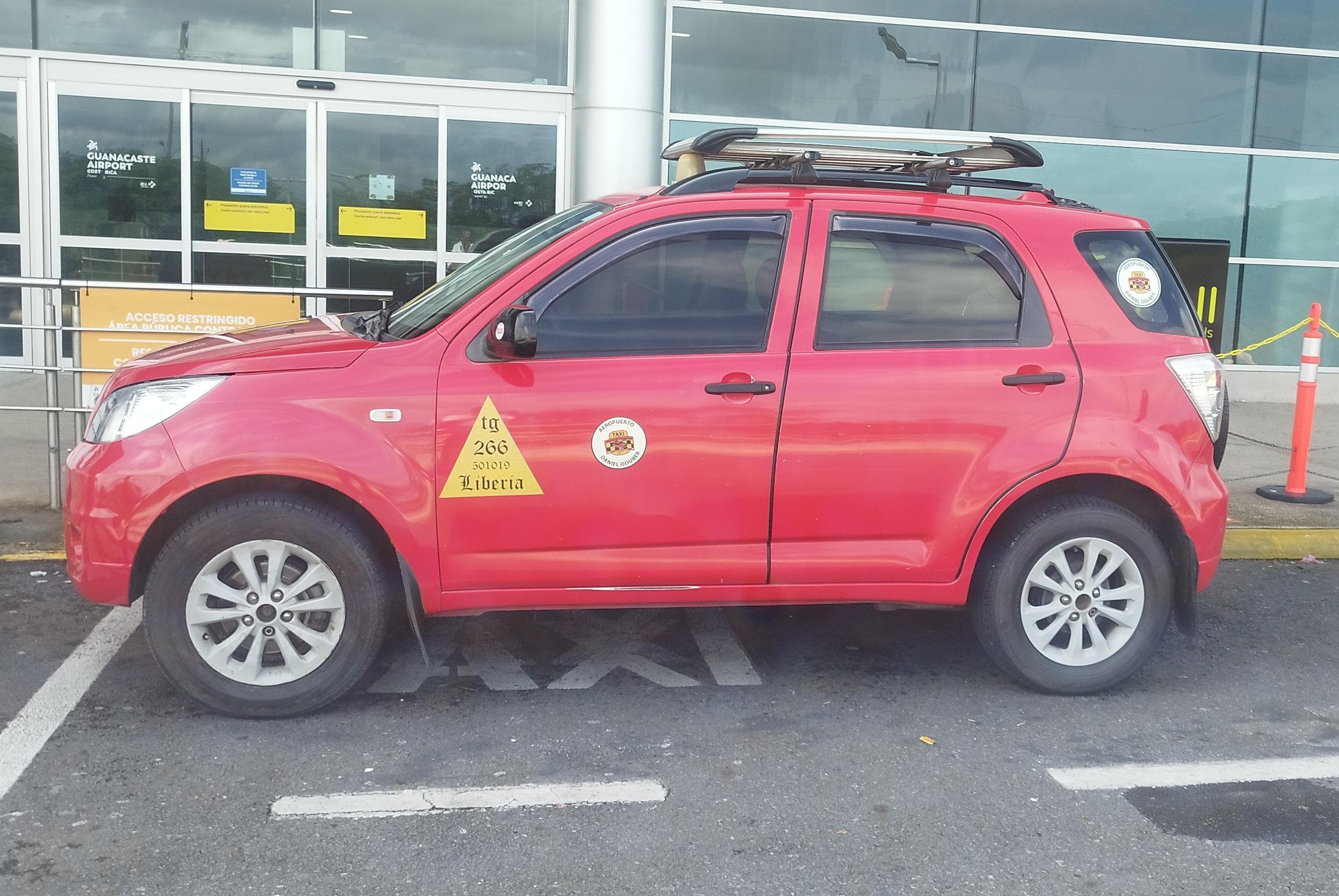 Official red Guanacaste Airport Taxi at Guanacaste Airport